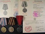 Medaile za osvobození Prahy, za vítězství nad Německem, medaile za zásluhy o obranu vlasti, vše s průkazy