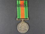 Medaile obrany, na hraně vyraženo jméno G.E.Ludditt
