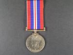Válečná medaile 1939-45, na hraně vyraženo jméno G.E.Ludditt